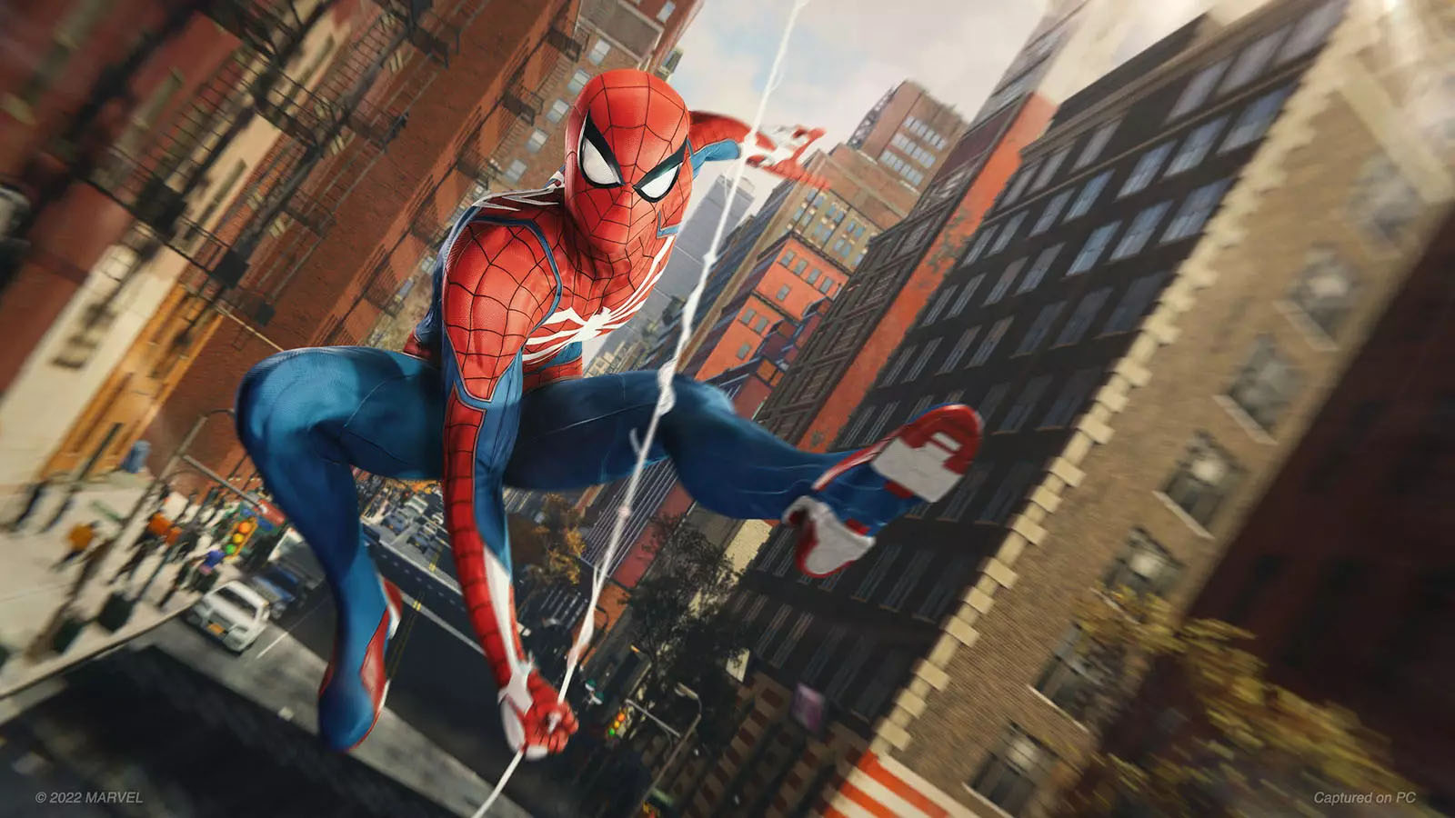 Spider-Man swinging through a city on a strand of web.
