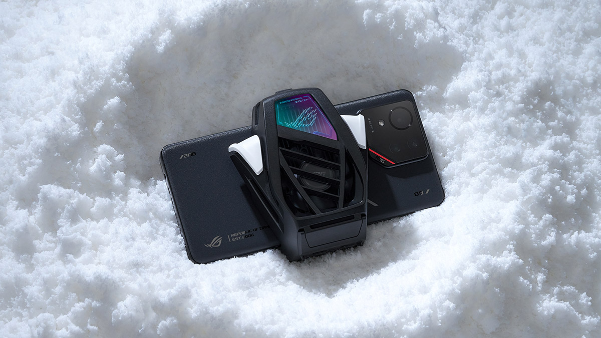 An ROG Phone with the AeroActive Cooler attached lying in the snow